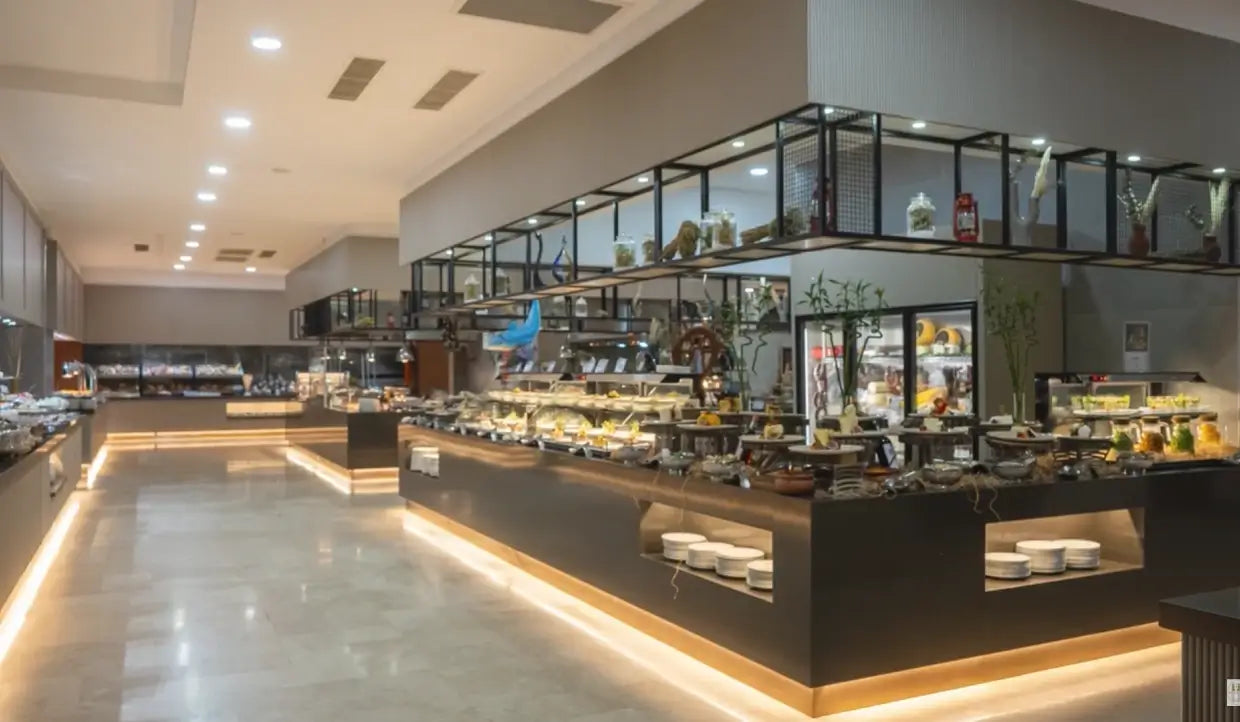 6-inch LED round commercial downlights illuminating a hospitality buffet and dining area