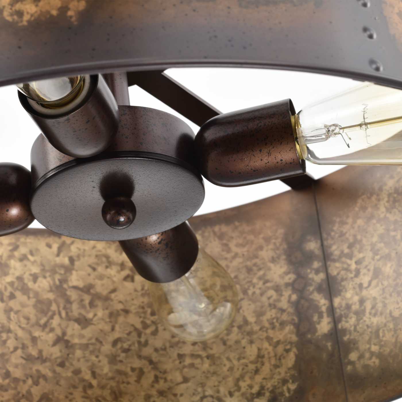 Close-up detail of a rustic bronze metal light fixture with visible screw posts, round central plates, and clear glass bulbs inside a textured brown shade.