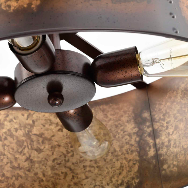 Close-up detail of a rustic bronze metal light fixture with visible screw posts, round central plates, and clear glass bulbs inside a textured brown shade.
