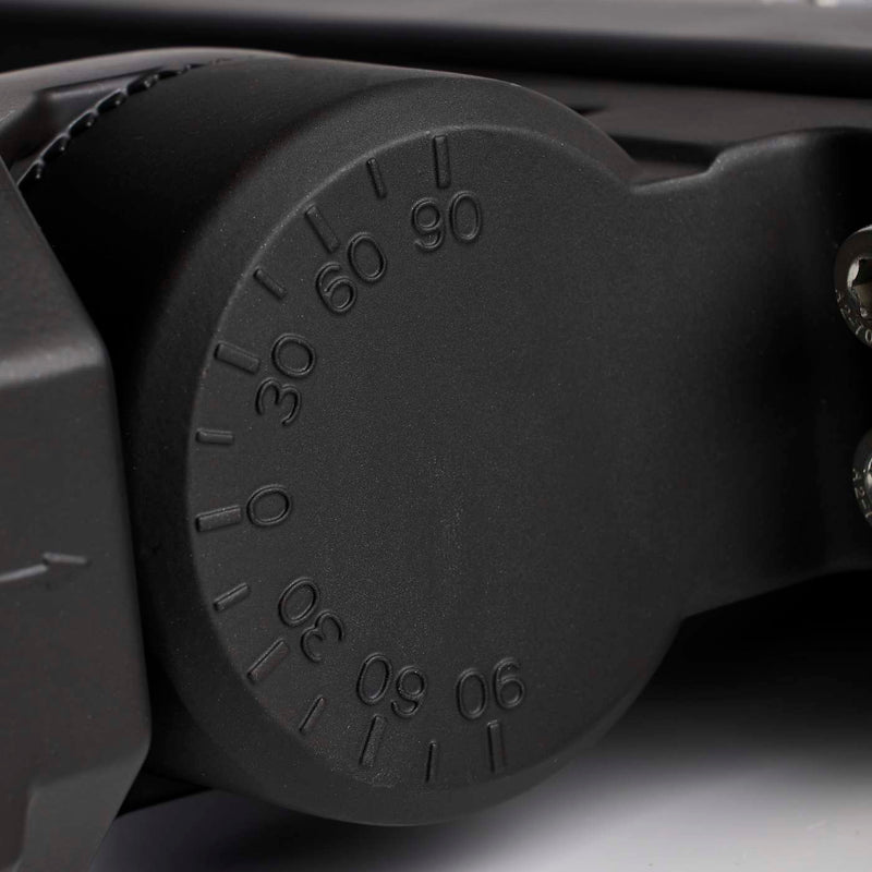 Close-up of a black adjustable wrench handle with measurement markings.