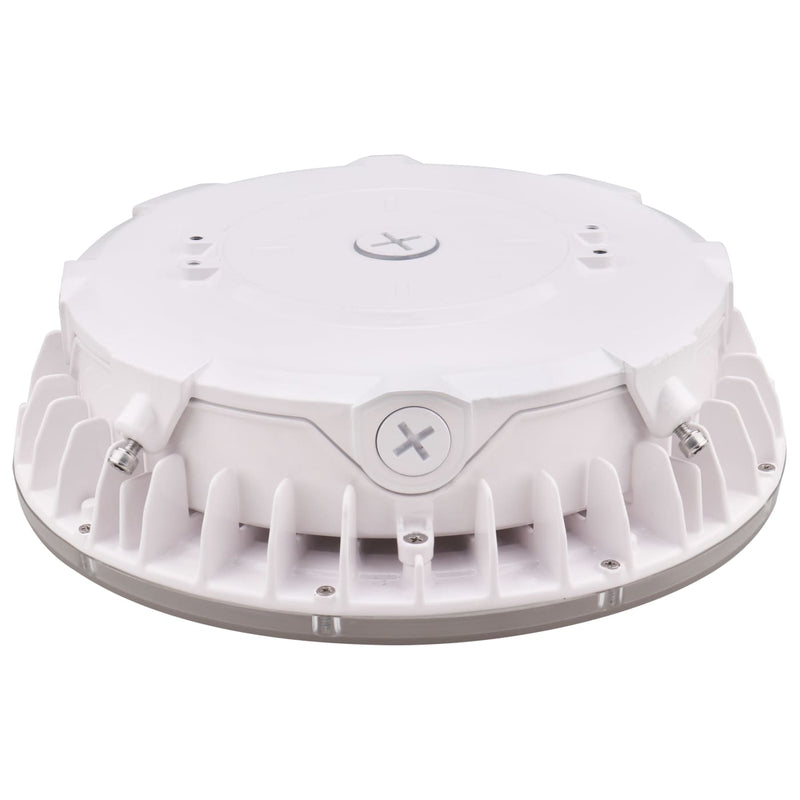 A white circular electronic device with a ribbed outer base and a flat top cover, photographed on a clean white background.