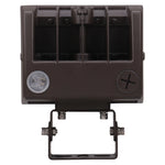 A dark brown rectangular outdoor light fixture with a mounting bracket, featuring a circular lens on the left and a screw terminal on the right, isolated on a white background.