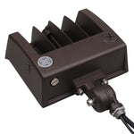 A dark brown marine electronic component, likely a battery charger or alternator, featuring a ribbed metal heat sink, terminal screws, and a black cable connector with a metal terminal block, shown on a white background.