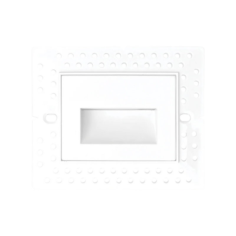 A white recessed light fixture cover plate with a circular mounting pattern of small dots around the border and a central rectangular recess.