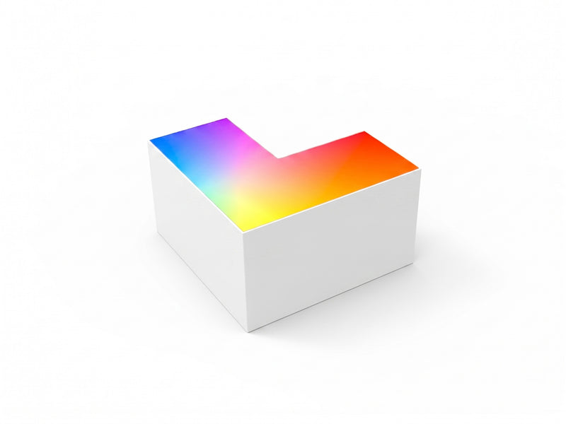 White l-shaped rgbw beam connector with smooth glossy surface displaying vibrant rainbow colors on top for architectural use