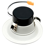 Downlight fixture with black lens and white trim on a white background