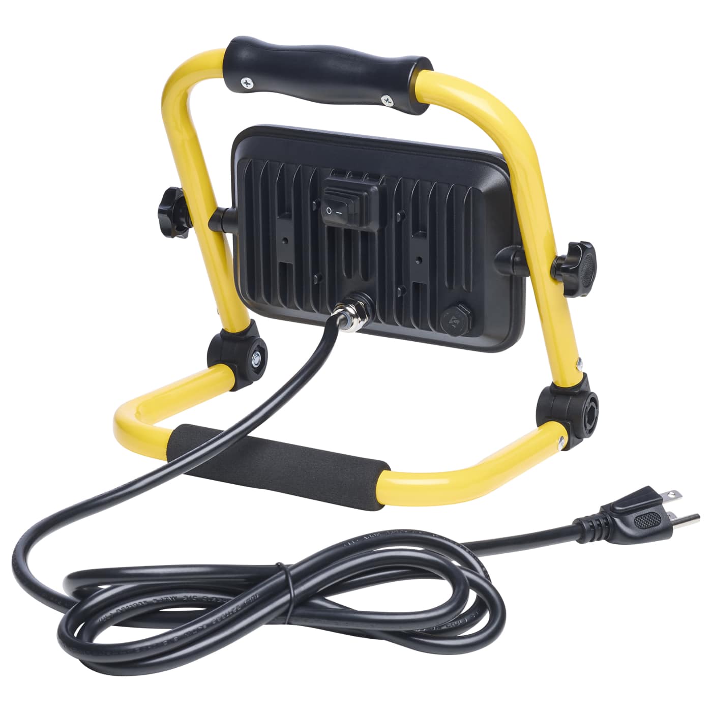 A portable work light with a yellow metal frame, black handle, and black cooling fins on the back, shown with its attached black power cord on a white background.