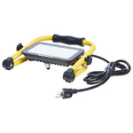 A yellow and black portable LED work light with a built-in handle and attached power cord, shown on a plain white background.