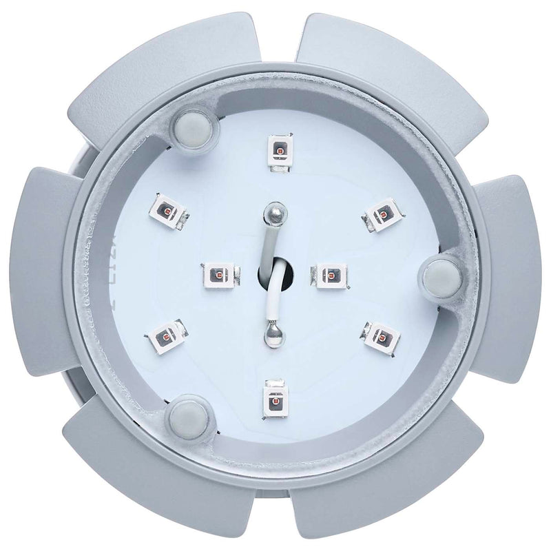 Light gray gear-like object with a white center on a white background