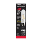 A SATCO decorative LED T20 bulb in its original retail packaging. The packaging is black with red and white text, featuring a graphic of the clear glass bulb with a warm yellow filament.