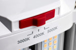 Close-up of a white LED light fixture showing a red switch slider and temperature labels for 3000K, 4000K, and 5000K.