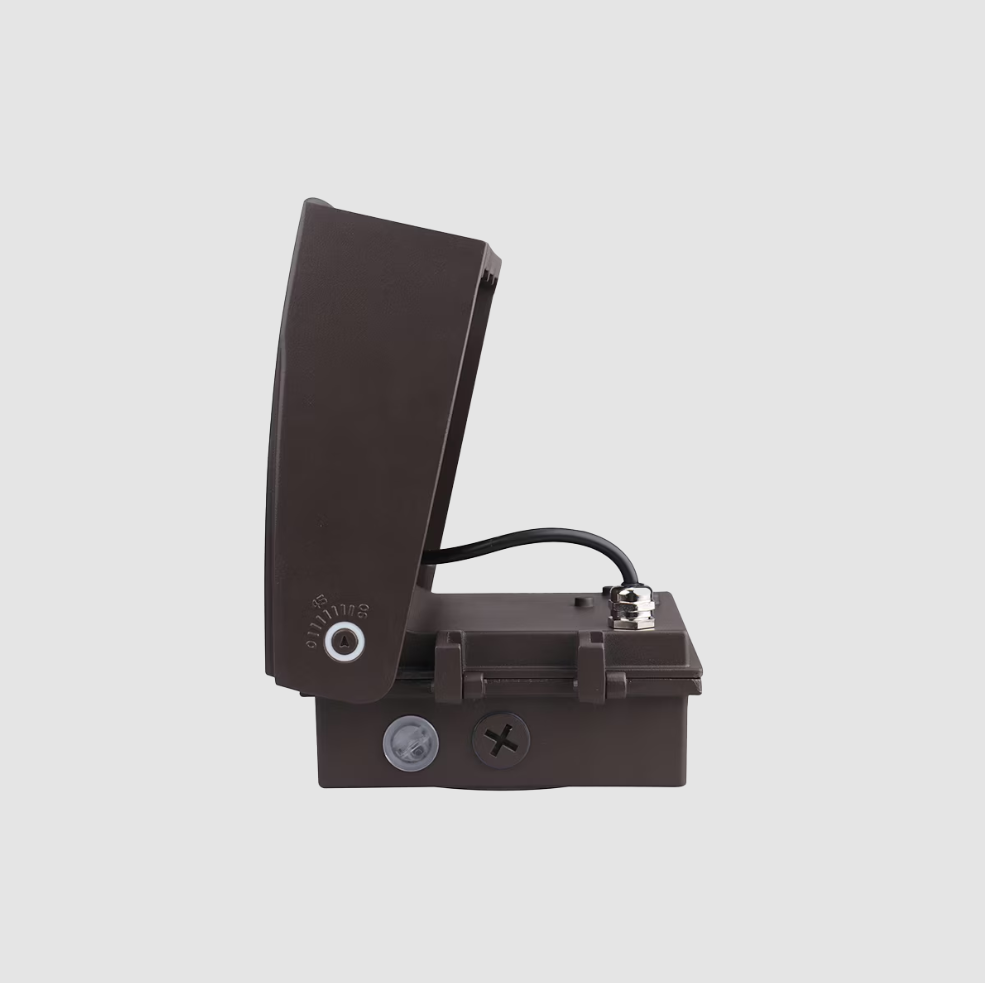 Bronze outdoor wall pack light on a gray background