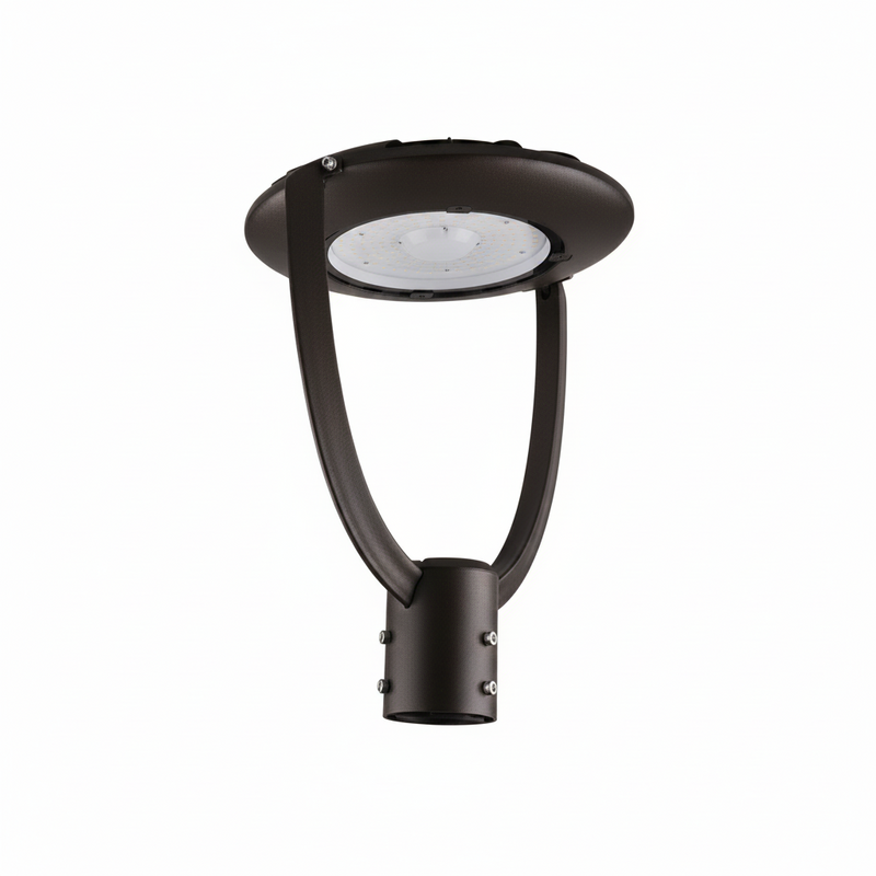 A modern black outdoor post top light fixture with a circular head and curved mounting arm, shown against a solid light gray background.