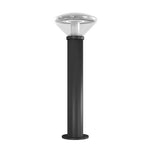 Black cylindrical vandal resistant solar bollard light with clear dome-shaped glass top and adjustable color temperature