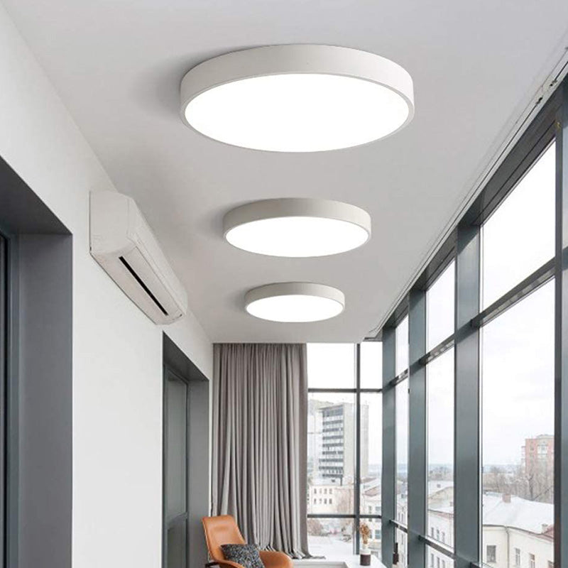 Three circular white led round pendant lights with modern minimalist design 18 inch 4550 lumen max wattage selectable