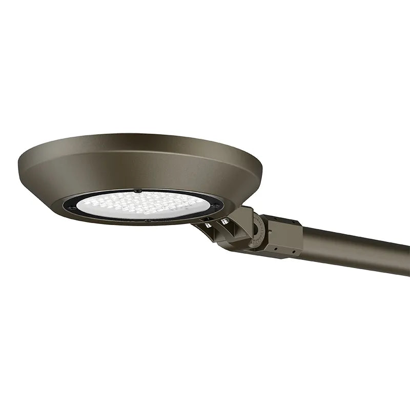 A modern outdoor LED street light with a circular shade, adjustable mounting bracket, and a long cylindrical pole, shown against a plain white background.