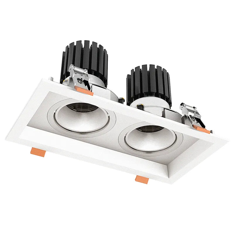 White rectangular recessed led architectural light fixture with two black ribbed spotlights and chrome accents