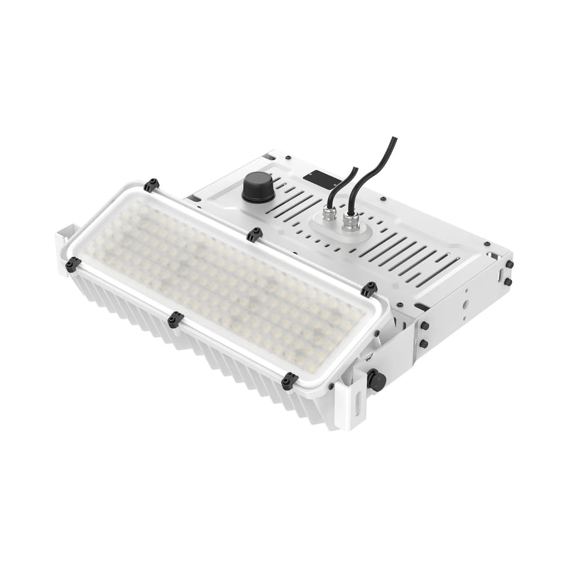 A white industrial LED light fixture with a ribbed metal housing, a clear protective lens, a black control knob, and attached power cables, shown on a solid white background.