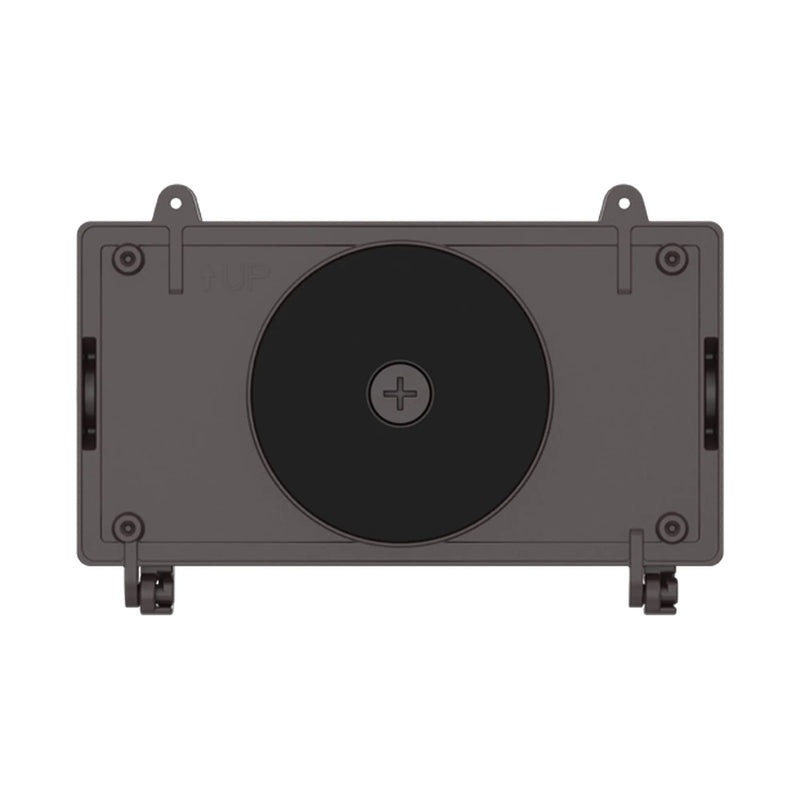 A bronze rectangular electronic device with a large black circular panel on the front, four mounting holes, and small side connectors, shown on a plain white background.