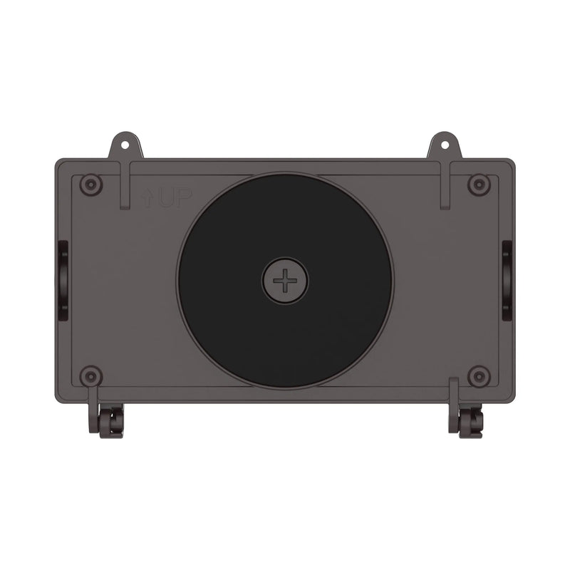 A bronze rectangular mounting plate with a large black circular insert in the center, shown against a plain white background.